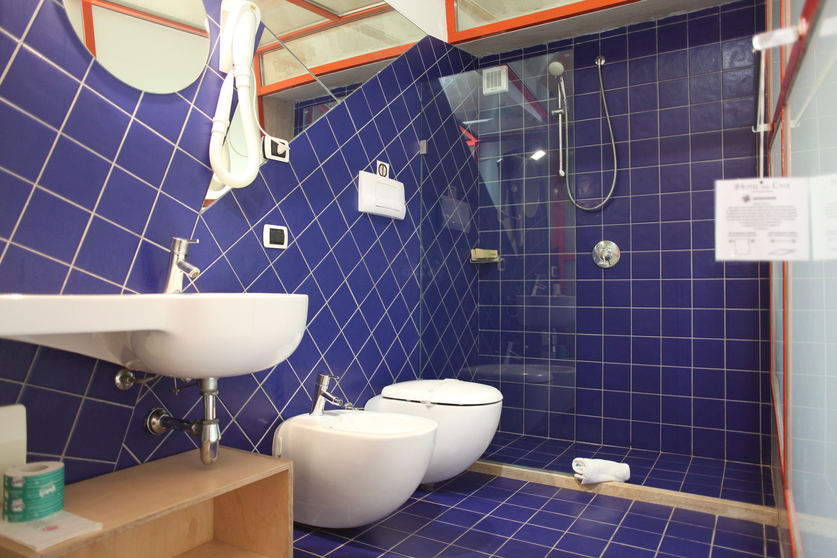 deluxe room | bathroom | shower, hair dryer, towels