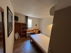 Economy Room | Memory-foam beds, individually furnished, desk, iron/ironing board