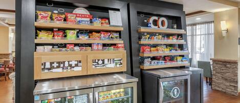 A vending area with snacks and drinks, including Doritos, Lay's, and Mountain Dew.