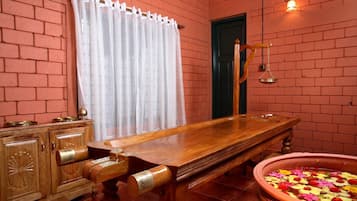 Traditional charm fills this room with a bench, cabinet, and window.