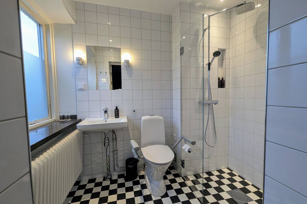 family room | bathroom | shower, free toiletries, hair dryer, towels