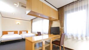 A hotel room with two beds, a desk with a television, and a large window with curtains. - Flexstay Inn Sugamo (Tokyo)