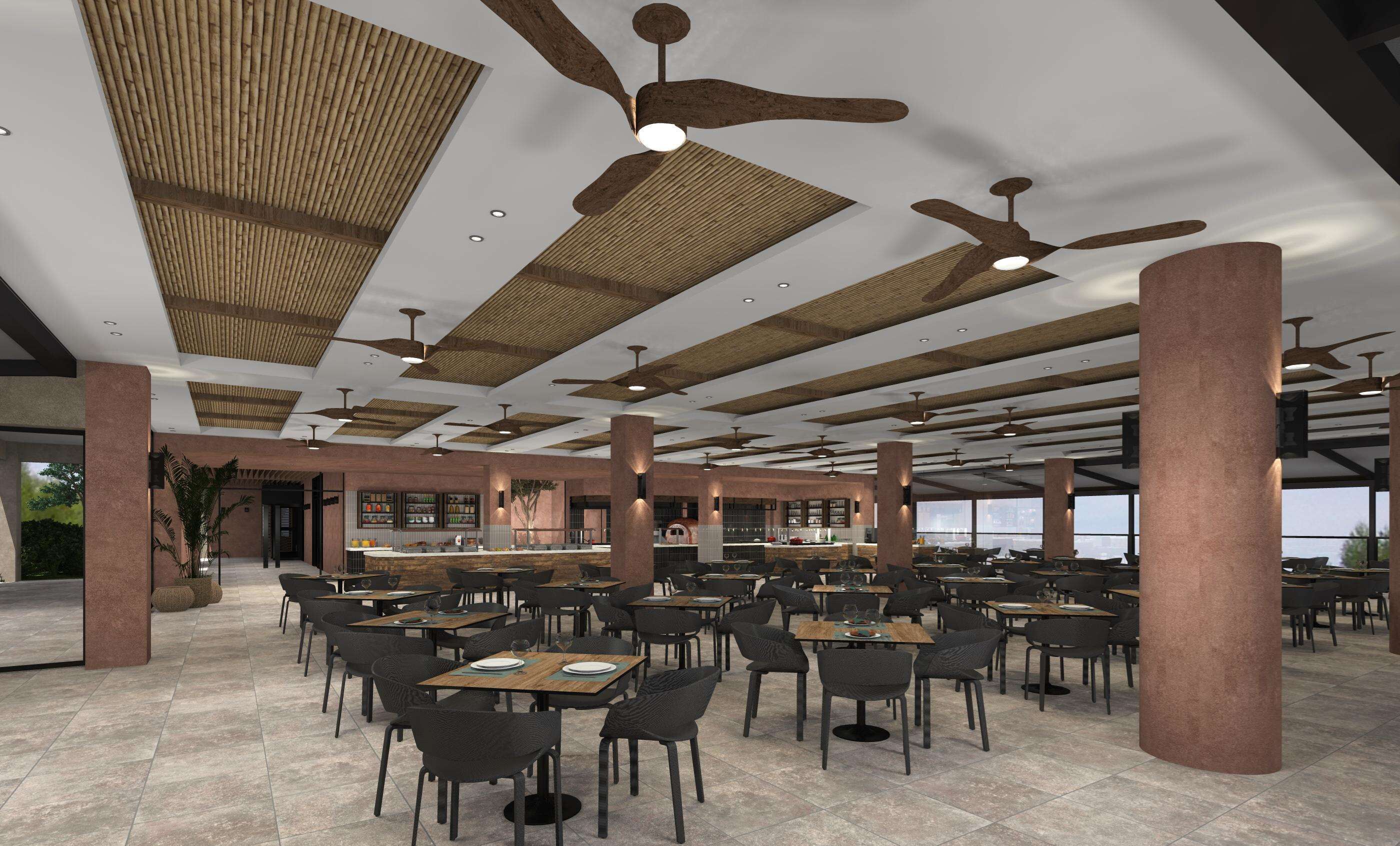 A spacious indoor dining area with multiple tables and chairs, ceiling fans, and a bar area.