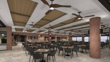 A spacious indoor dining area with multiple tables and chairs, ceiling fans, and a bar area.