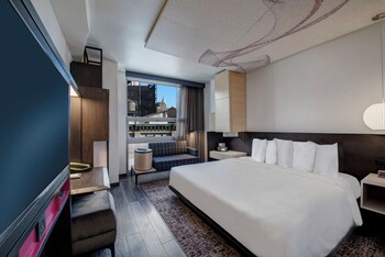 Premium bedding, in-room safe, desk, blackout drapes at Hyatt Herald Square New York