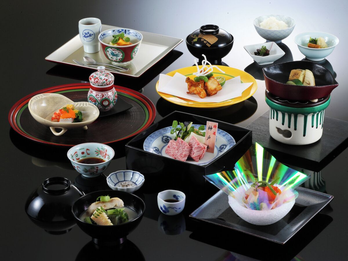 A variety of Japanese dishes and utensils arranged on a table.