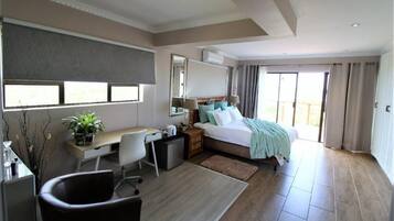 Deluxe Room | Down duvets, memory-foam beds, in-room safe, laptop workspace