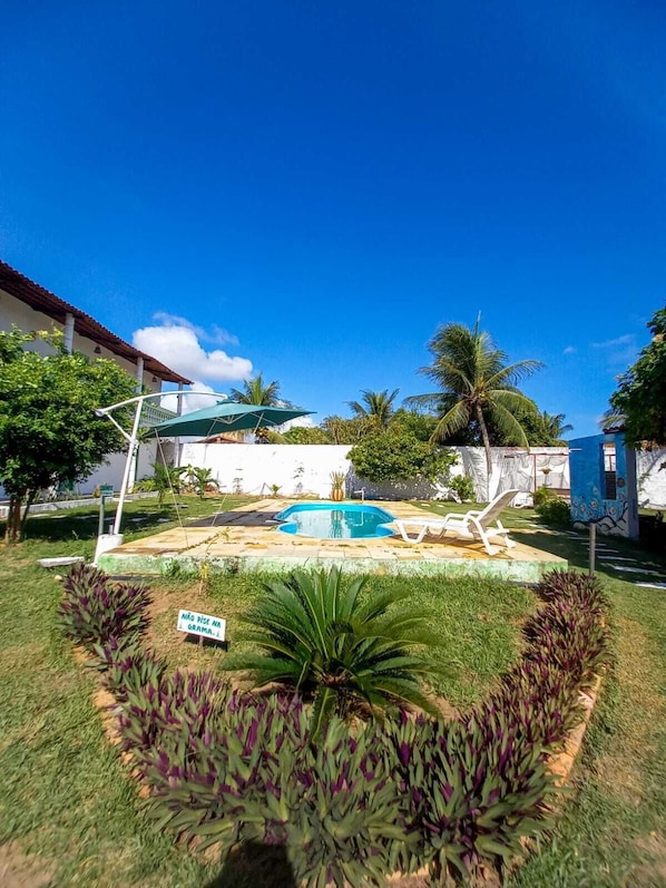 Outdoor pool, open 8:00 AM to 9:00 PM, pool loungers