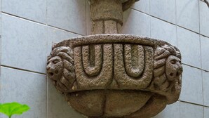 A stone fountain with a lion motif, set against a tiled wall. - Hotel de Don Pedro (Guatemala City)