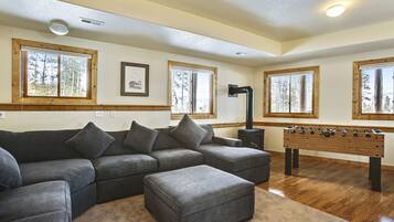 Cabin, 3 Bedrooms | Living room | TV, fireplace, foosball