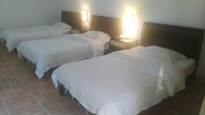 Triple Room | Desk, blackout drapes, free WiFi, bed sheets