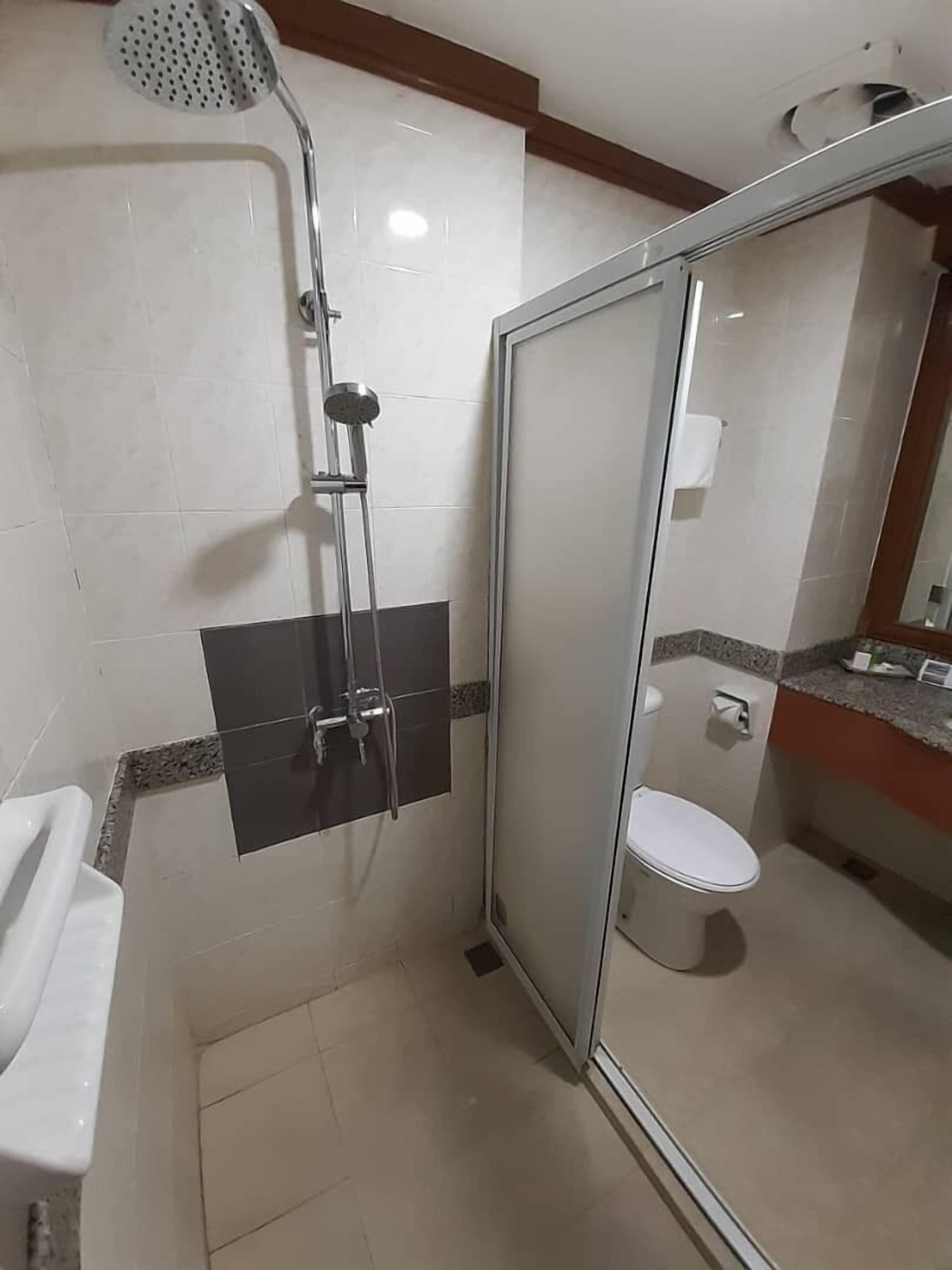 standard twin room | bathroom | hair dryer, bidet, towels, soap