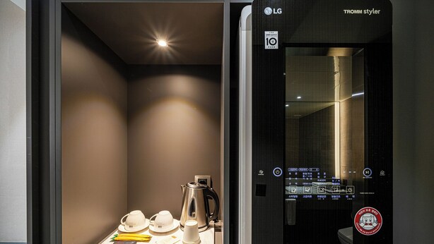 A modern bathroom with a sleek design, a visible control panel, and a towel rack. - Rivertain Hotel Gyeongju (Gyeongju)