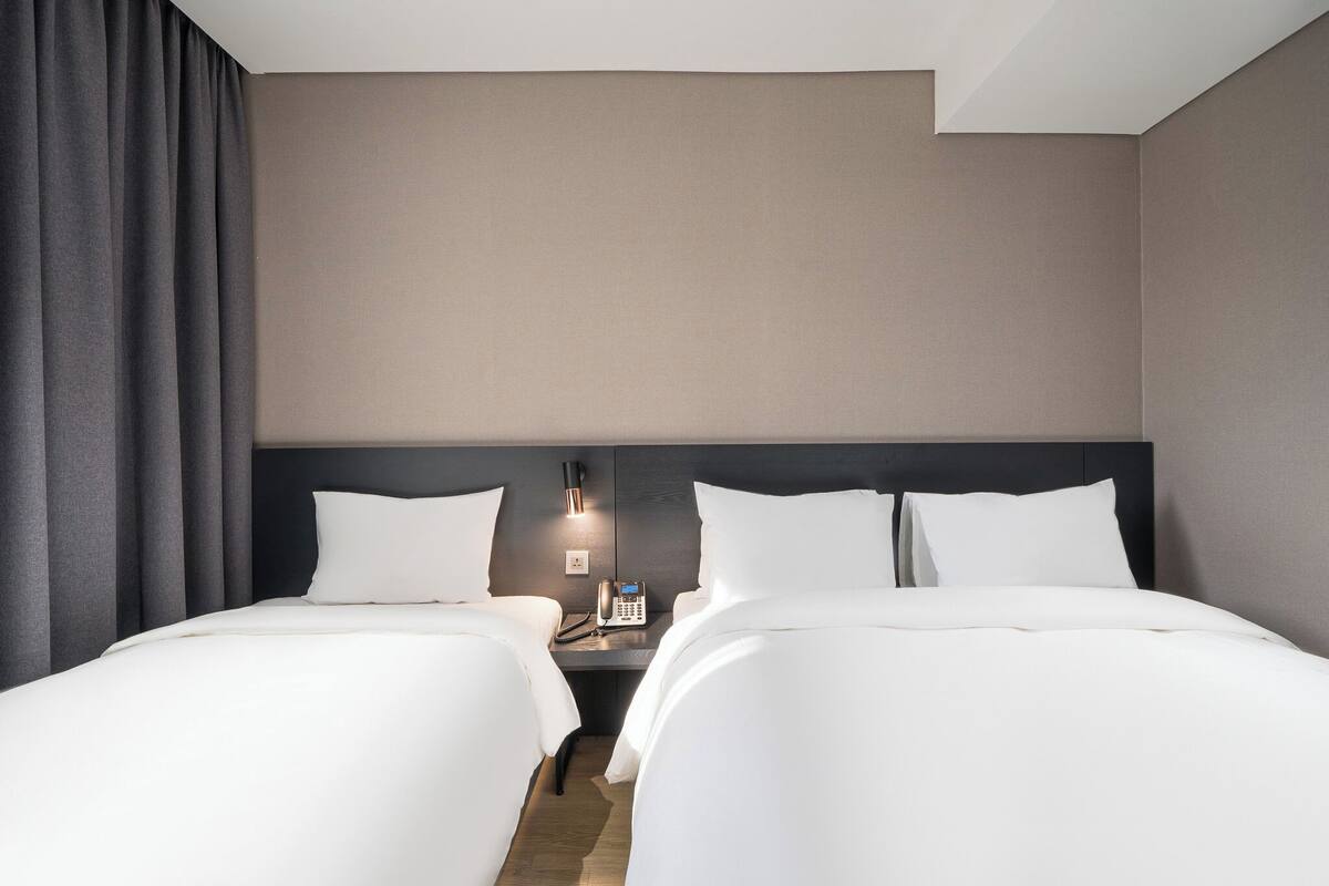 Suite, Multiple Beds, Non Smoking, City View | Down duvets, in-room safe, desk, blackout curtains