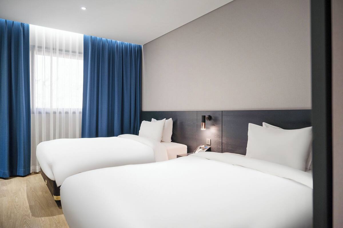 Family Twin Room | Down duvets, in-room safe, desk, blackout curtains