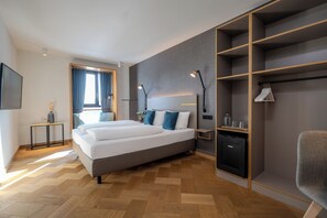 Habitación Deluxe | Ropa de cama hipoalergénica y caja de seguridad en la habitación 
