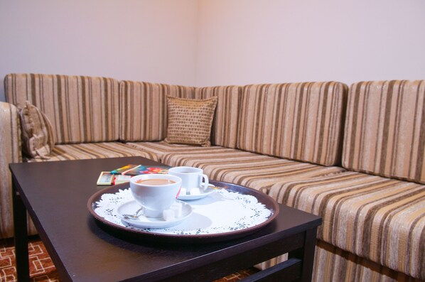Luxury Suite | Living area | Flat-screen TV