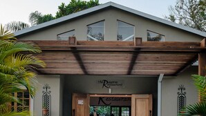A building with a sign reading "The Reserve Restaurant" at the entrance. - The Reserve Boutique Hotel (Mbombela)