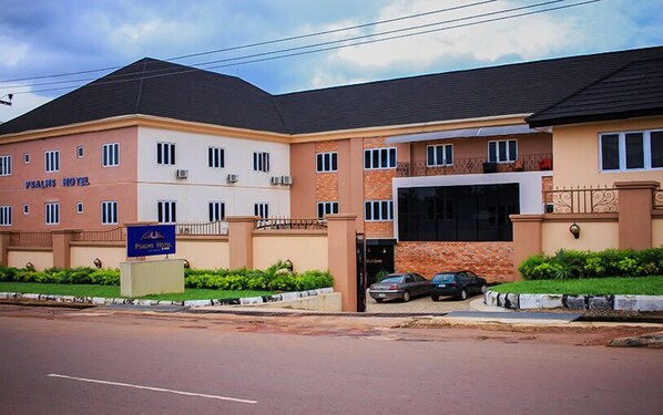 A multi-story hotel with a sign reading "Psalms Hotel". - Psalm Hotel (Enugu)