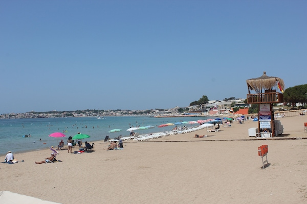 Beach nearby, beach umbrellas, beach volleyball
