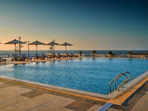 Outdoor pool, pool umbrellas, pool loungers