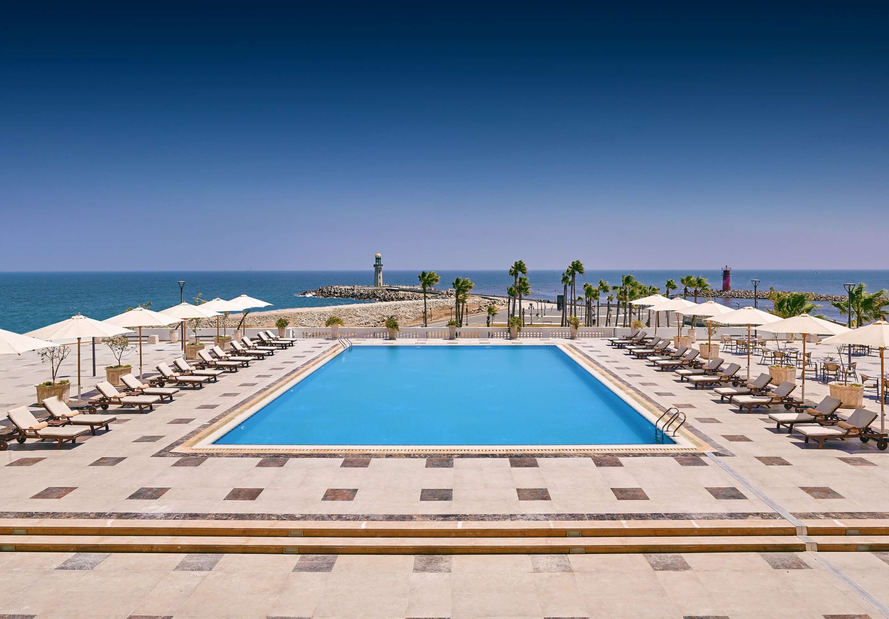 outdoor pool, pool umbrellas, pool loungers