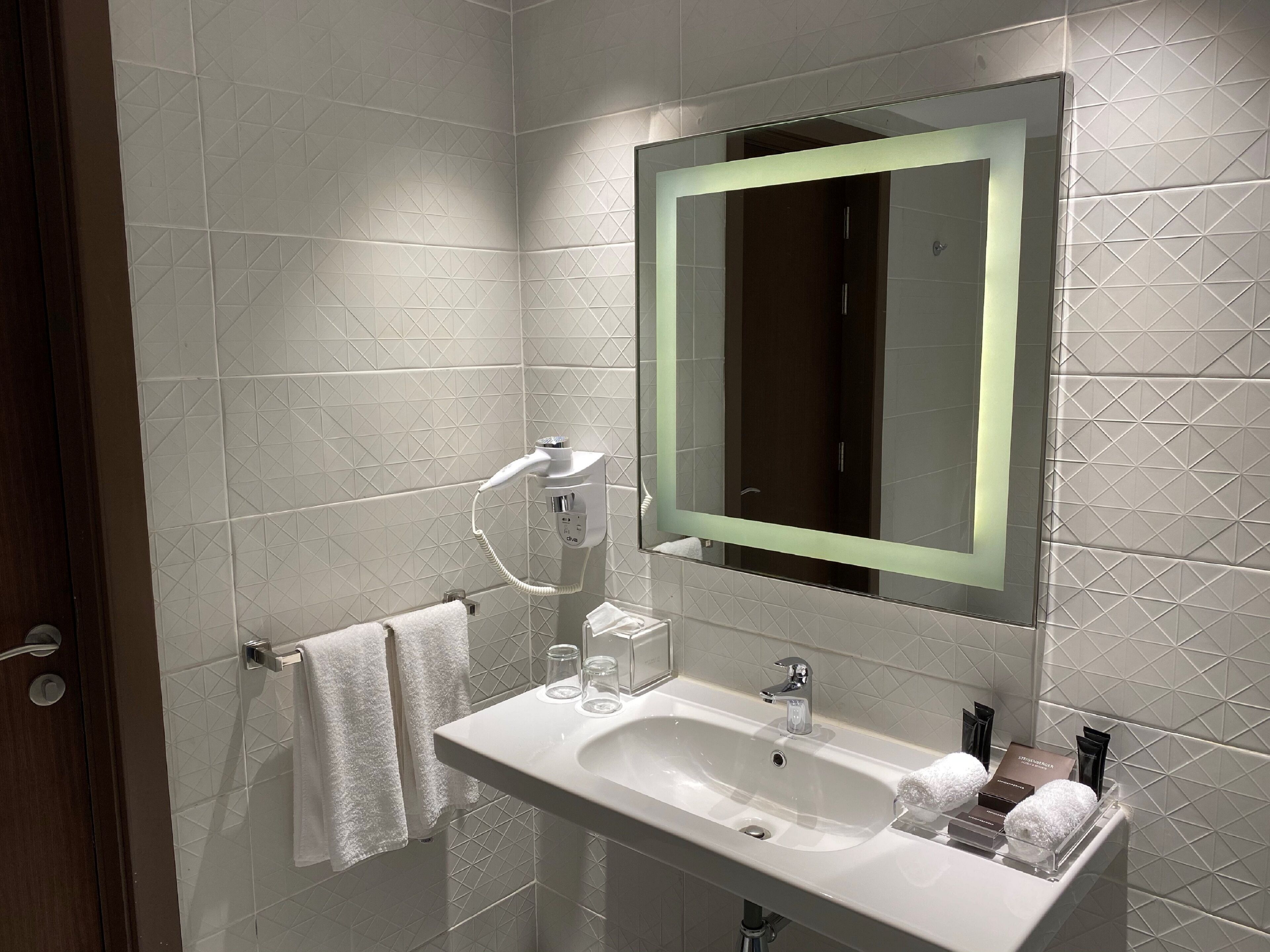 hair dryer, bathrobes, slippers, towels