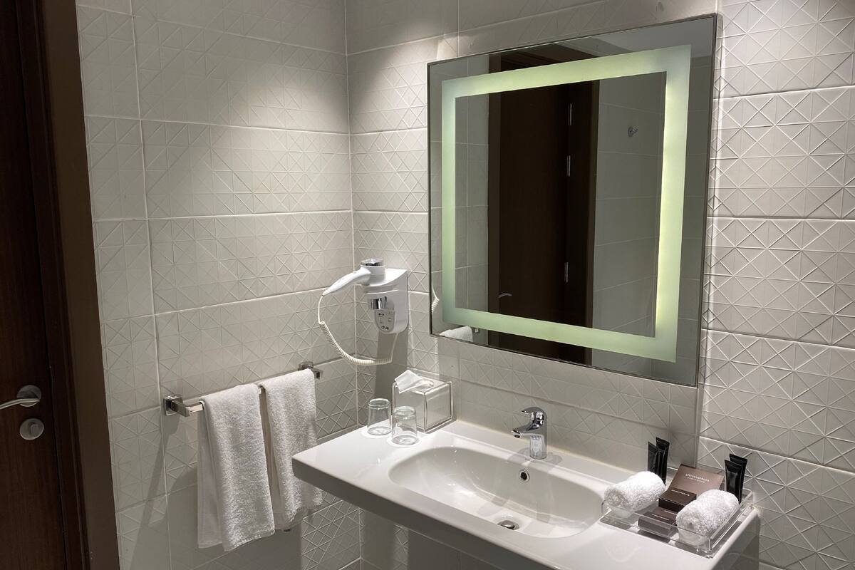 hair dryer, bathrobes, slippers, towels