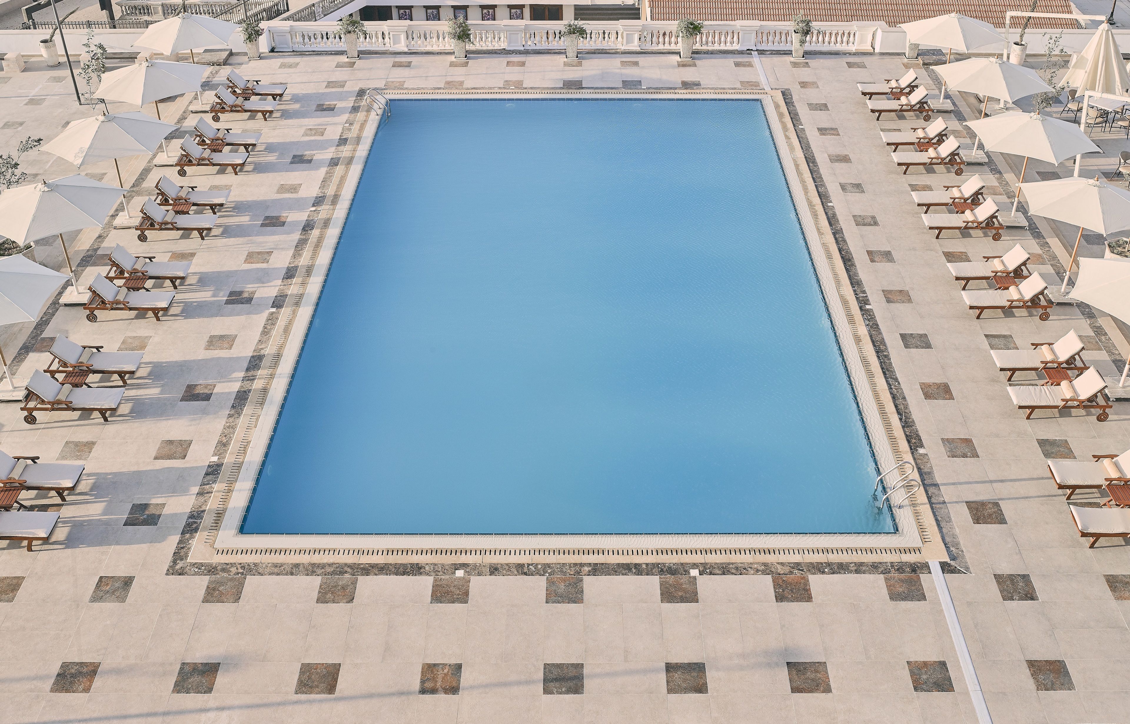 outdoor pool, pool umbrellas, pool loungers