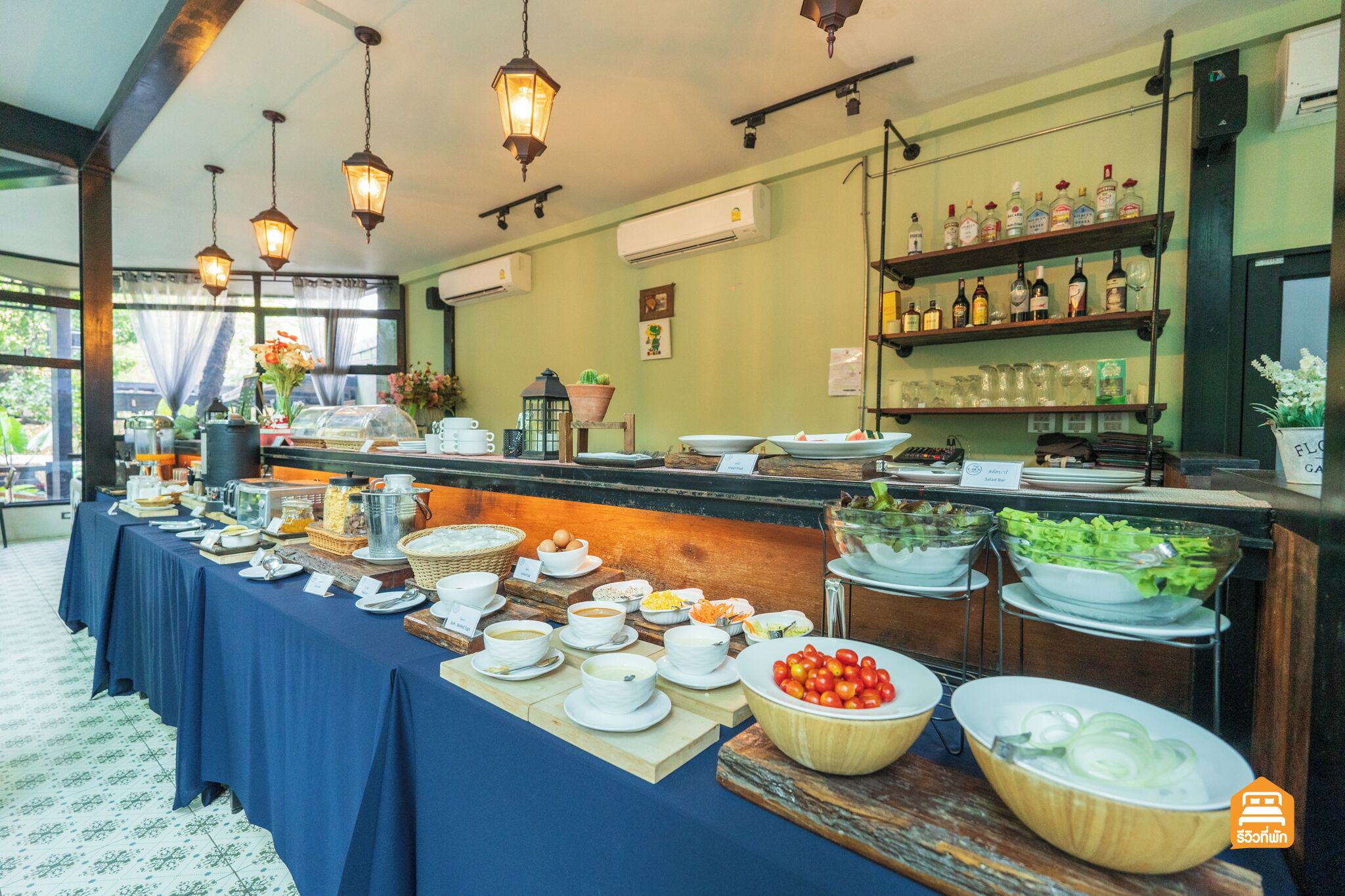 A buffet setup with various food items and beverages.