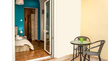 Apartment, Balcony (3 Nefeli) | Desk, iron/ironing board, free cribs/infant beds, travel crib