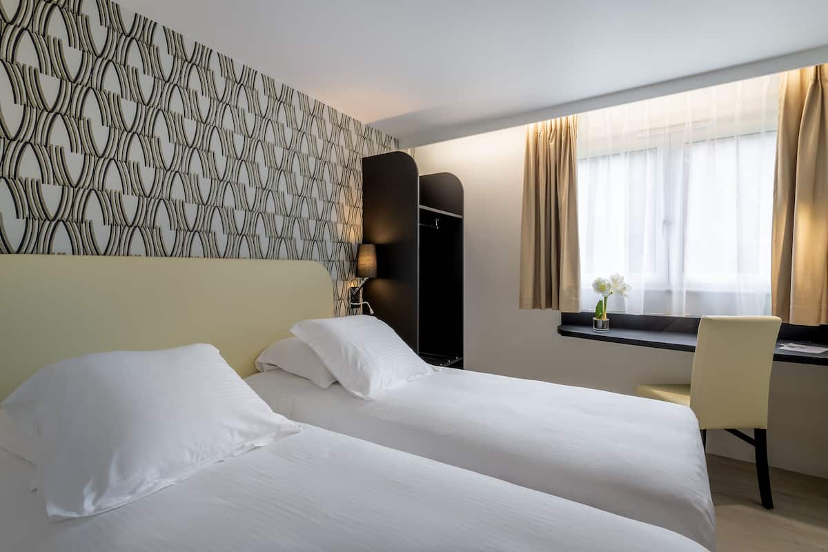 basic twin room, 2 single beds | premium bedding, individually decorated, individually furnished, desk