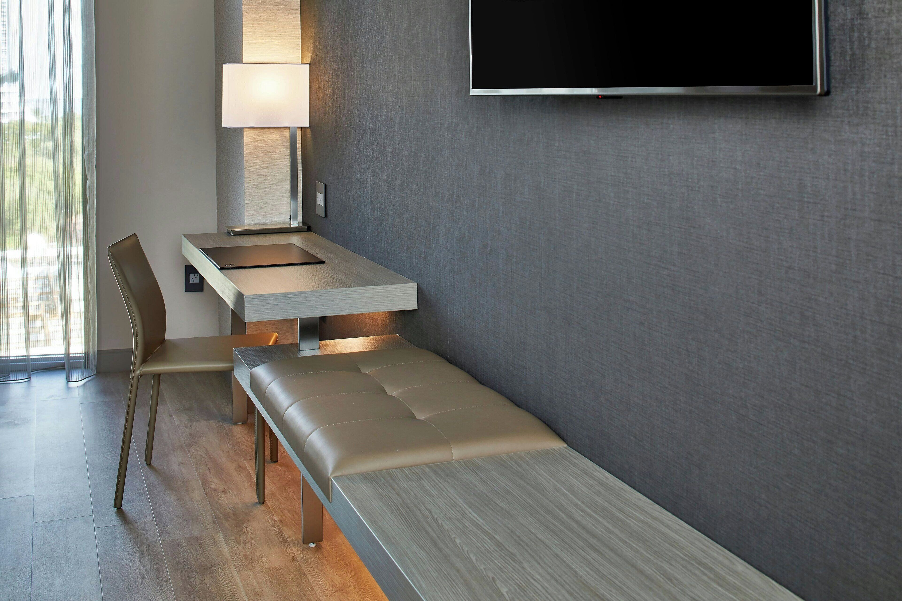 premium bedding, pillow-top beds, desk, laptop workspace