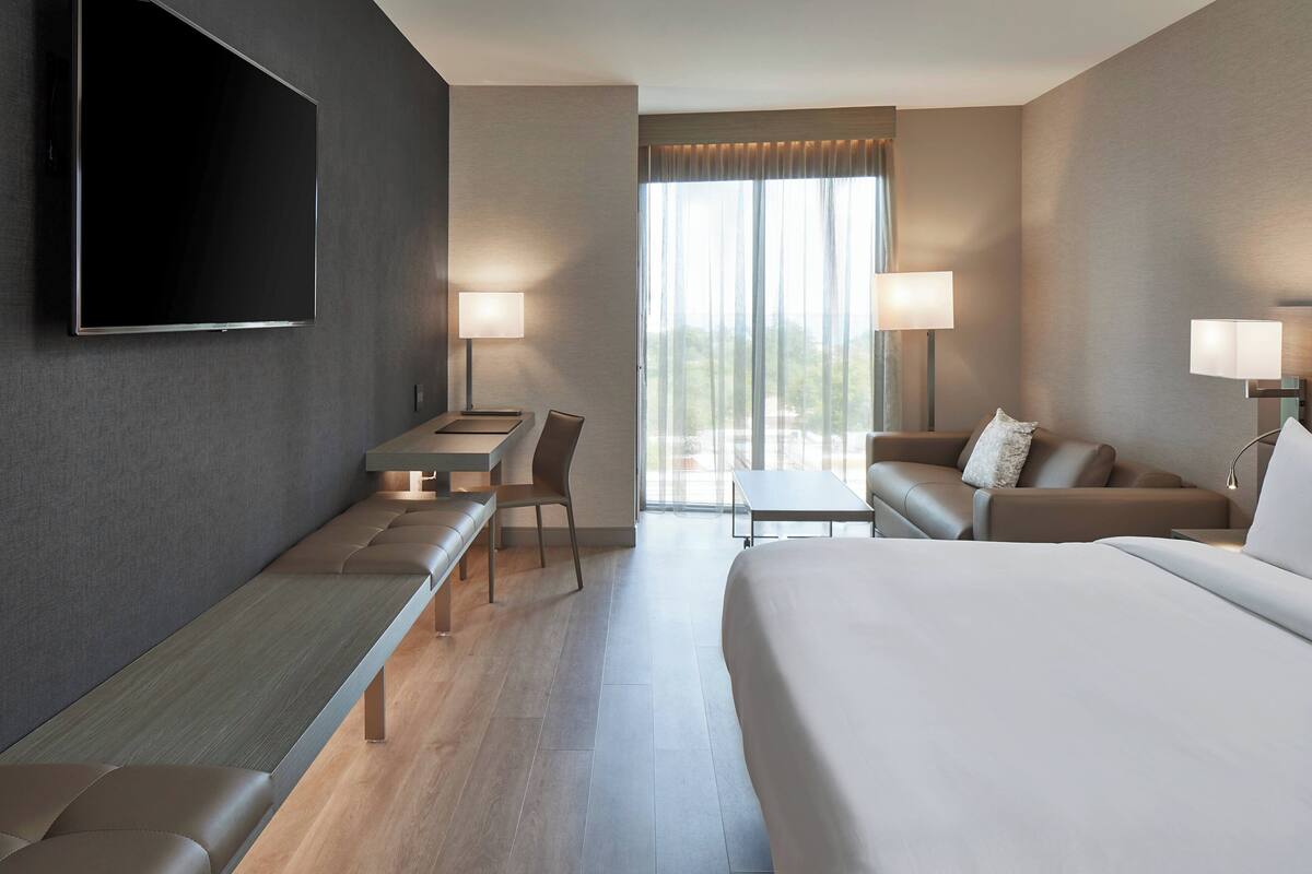 Premium bedding, pillow-top beds, desk, laptop workspace