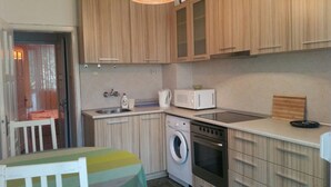 Economy Apartment | Private kitchen | Fridge, oven, stovetop, electric kettle