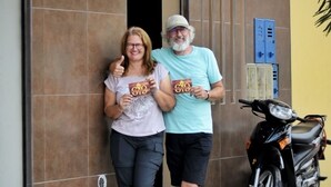 Two people standing in front of a building with a sign that reads "Studio 6069". - Studio 69 (Iquitos)