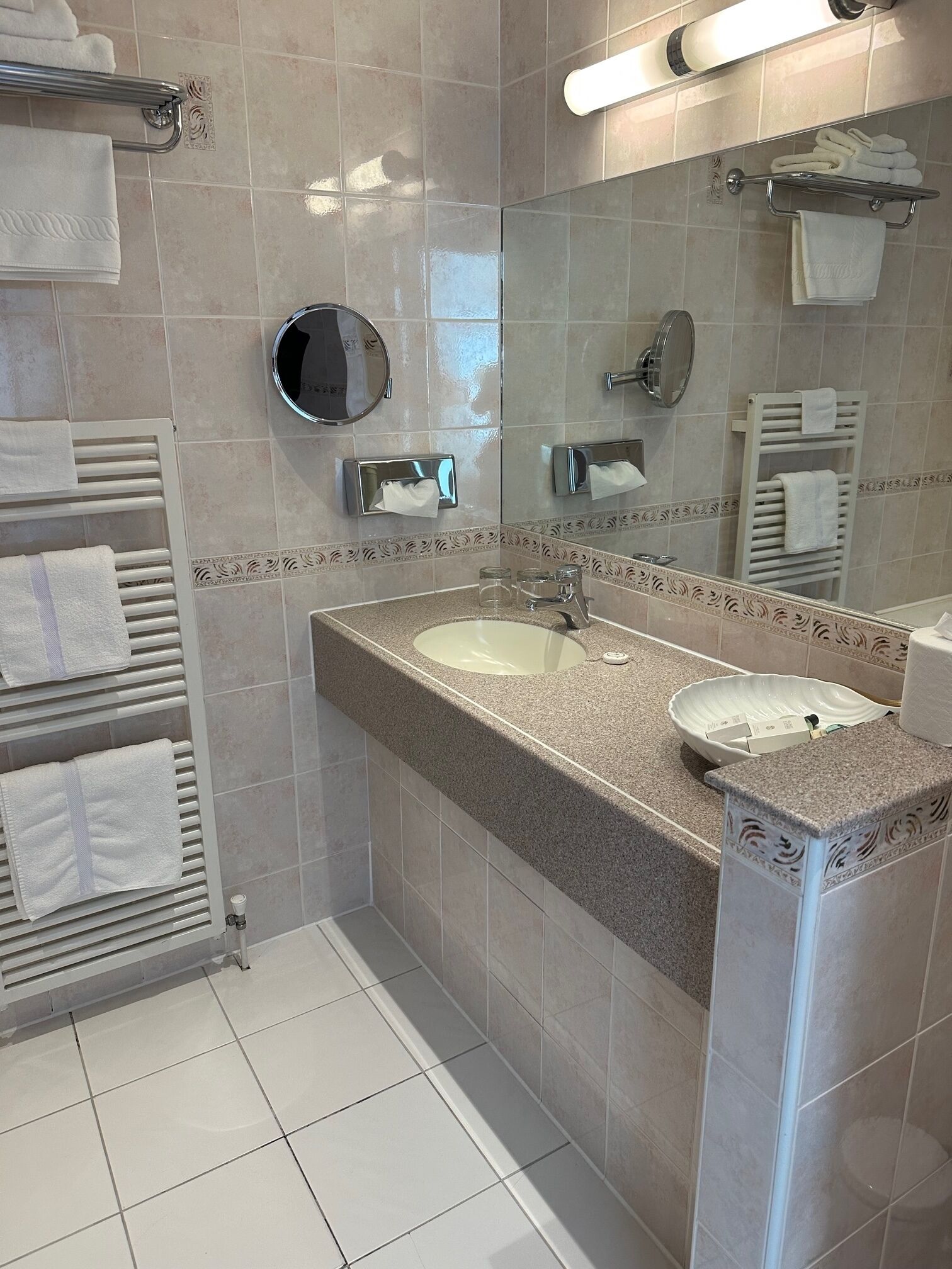 designer toiletries, hair dryer, towels, soap