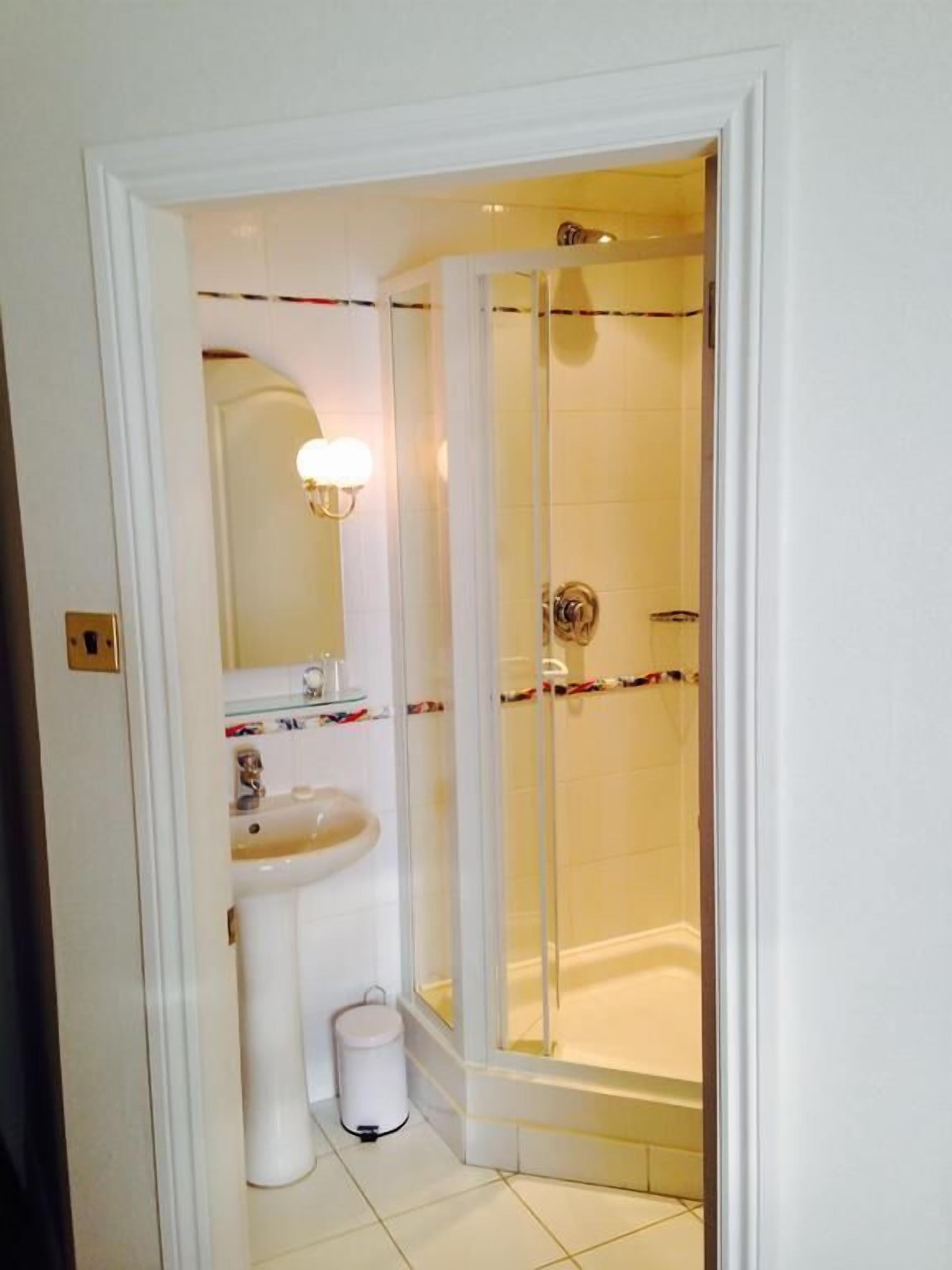 deluxe single room | bathroom | designer toiletries, hair dryer, towels, soap