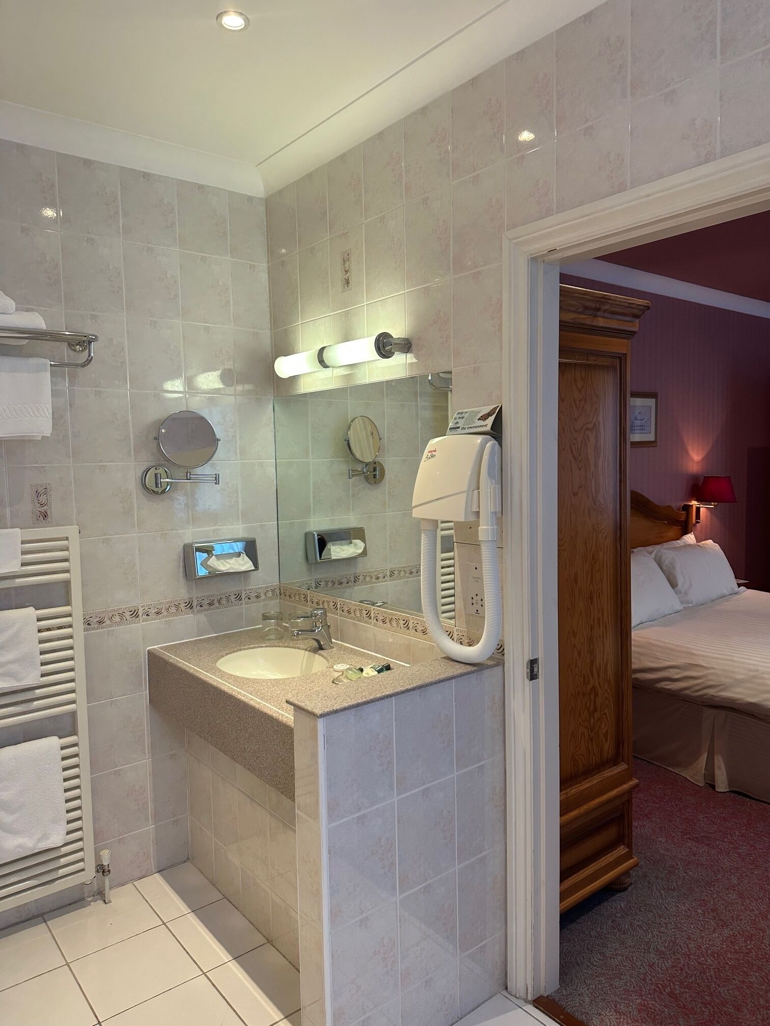 designer toiletries, hair dryer, towels, soap