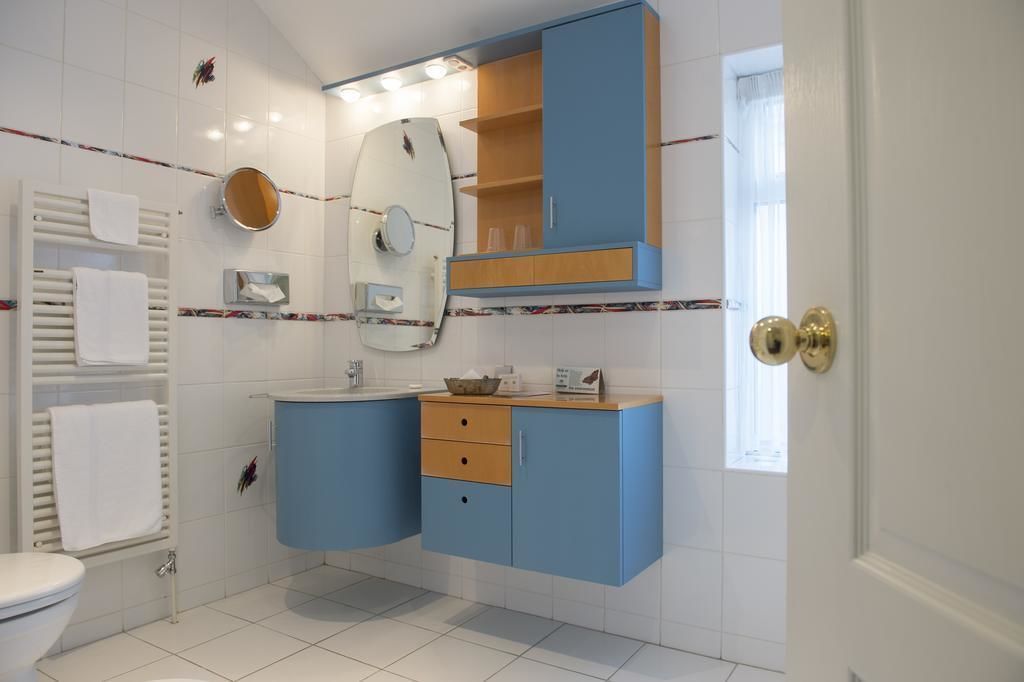 designer toiletries, hair dryer, towels, soap