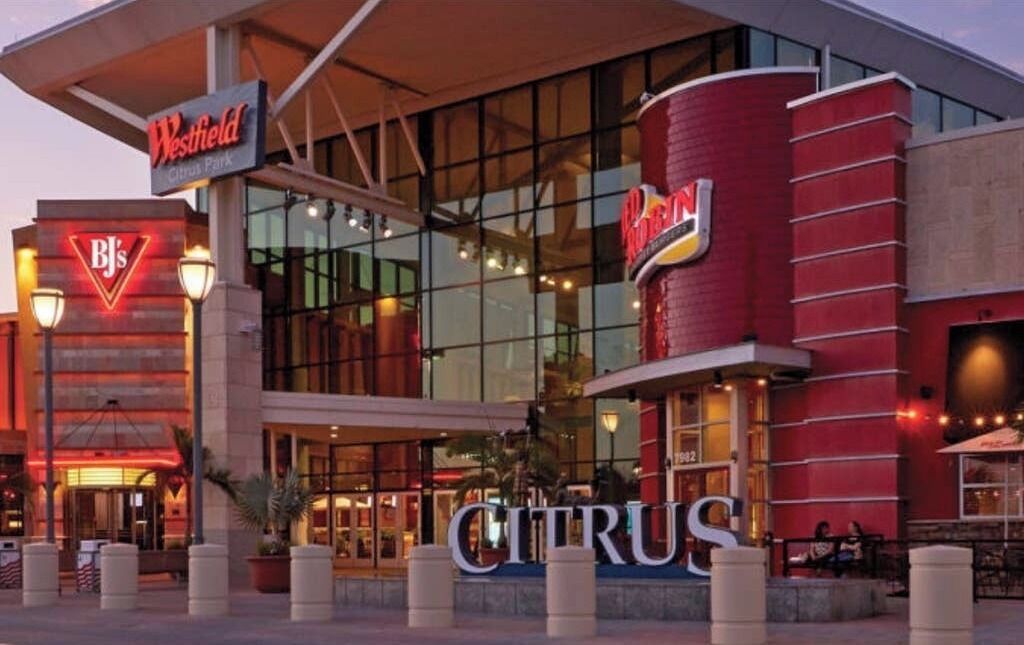 A hotel with a prominent Westfield sign, a large glass facade, and a visible entrance.