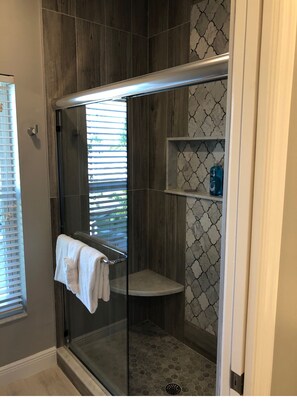 Bathtub, hair dryer, towels, soap