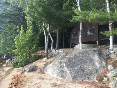 Beachfront Cottage on Ambajejus Lake With Sandy Beach and a Mountain View