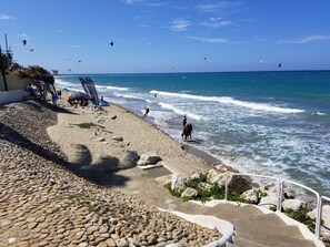 On the beach, sun-loungers, beach towels