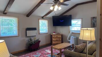 Living Room with 2 couches and Roku TV with Amazon Prime subscription