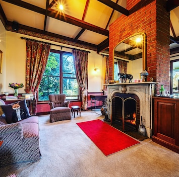 Drinks by the heritage log fireplaces in the drawing room.