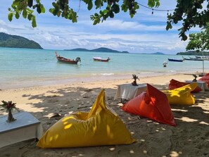 On the beach, sun-loungers