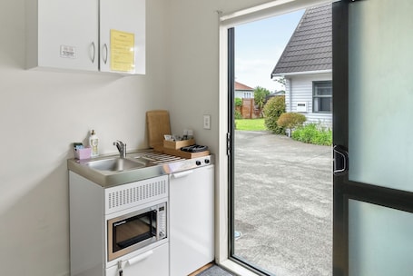 Fridge, microwave, electric kettle, toaster. Atarau Grove Studio