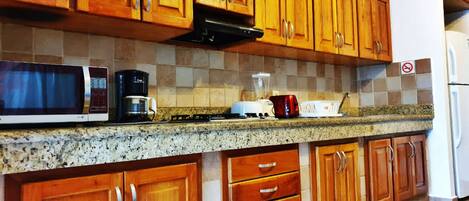 Fridge, microwave, stovetop, coffee/tea maker