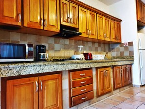 Fridge, microwave, stovetop, coffee/tea maker